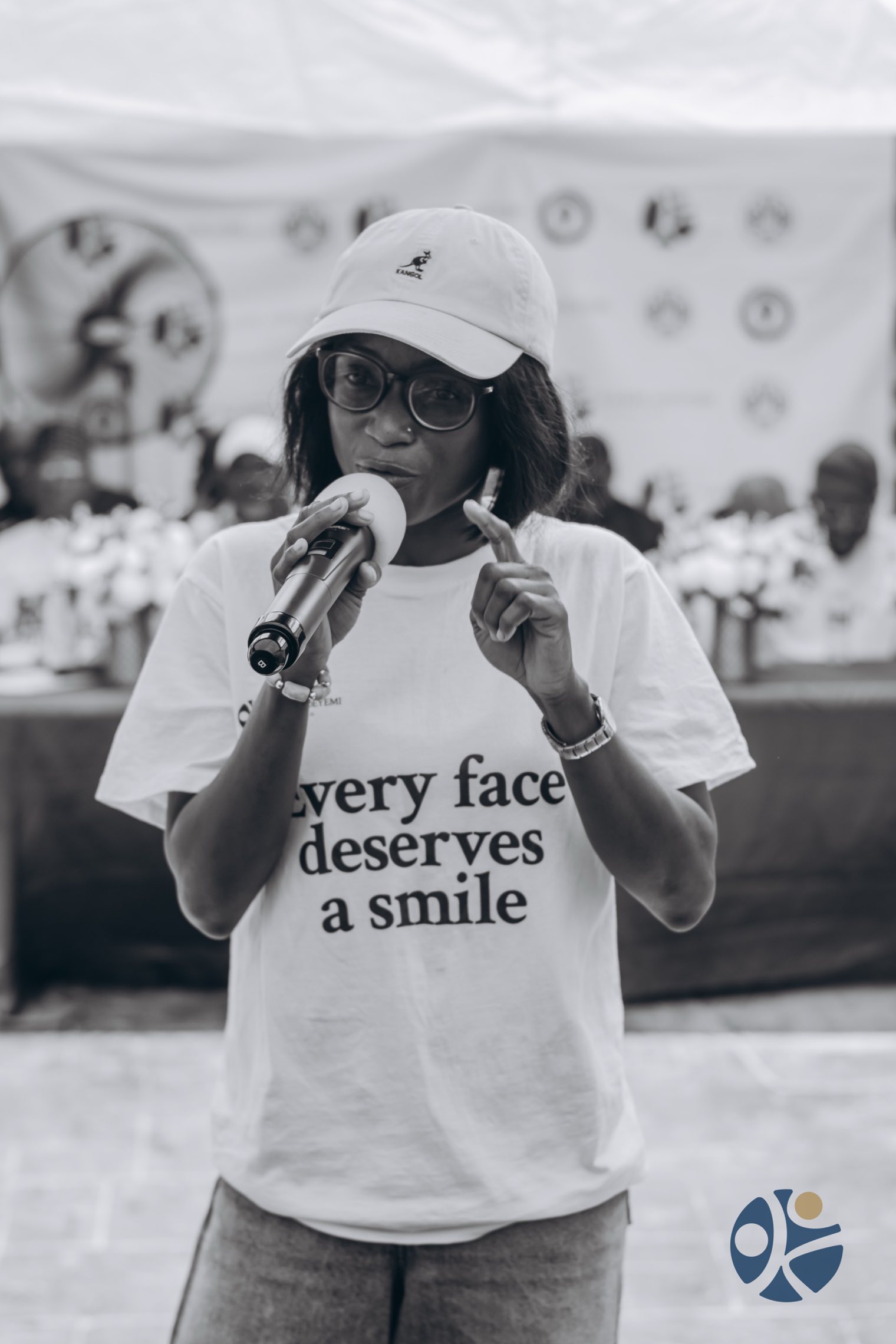 Addressing a community programme on the microphone